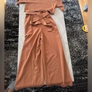 Tan two piece set. Cropped wide leg bottoms. Cropped top. Size medium.